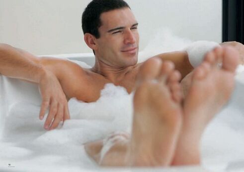 a man takes a baking soda bath to enlarge his penis