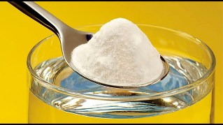 A teaspoon of baking soda in a glass of water to compress on the penis